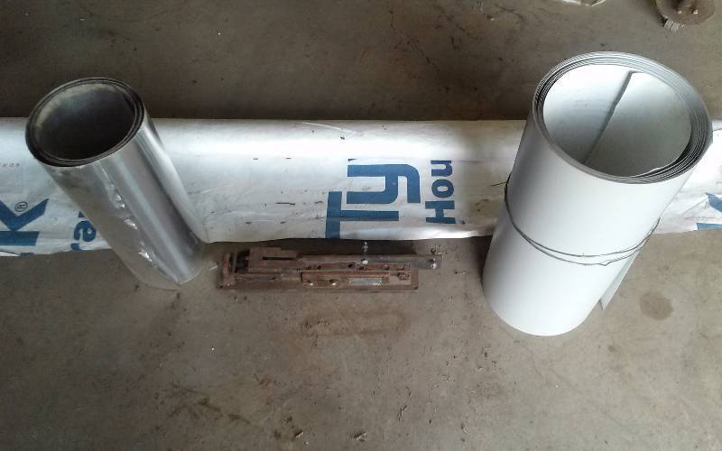 lot 15 image: Lot - Siding Cutter Double 5x5, flashing material & partial roll of Tyvek