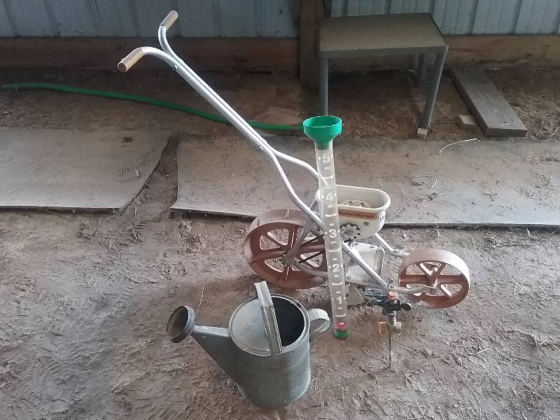 lot 238 image: Lot - Golden Harvet Planter, Misc Garden Seed Plates, Metal Watering Can, etc