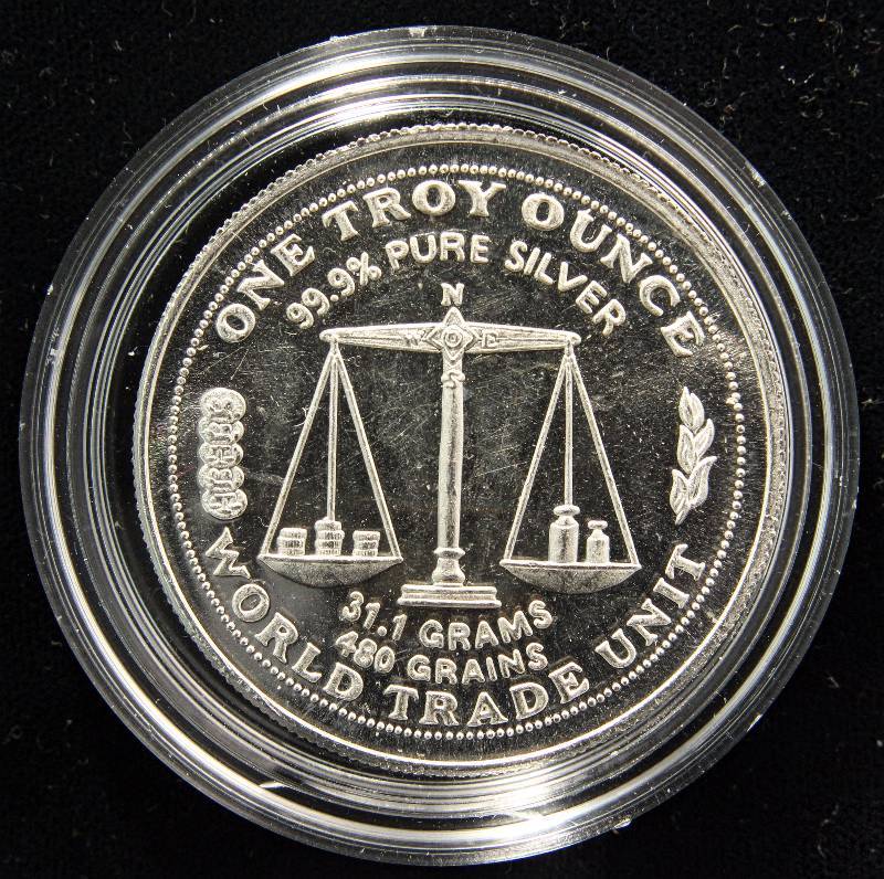 1 TROY OZ. .999 FINE SILVER WORLD TRADE ROUND IN AIRTIGHT