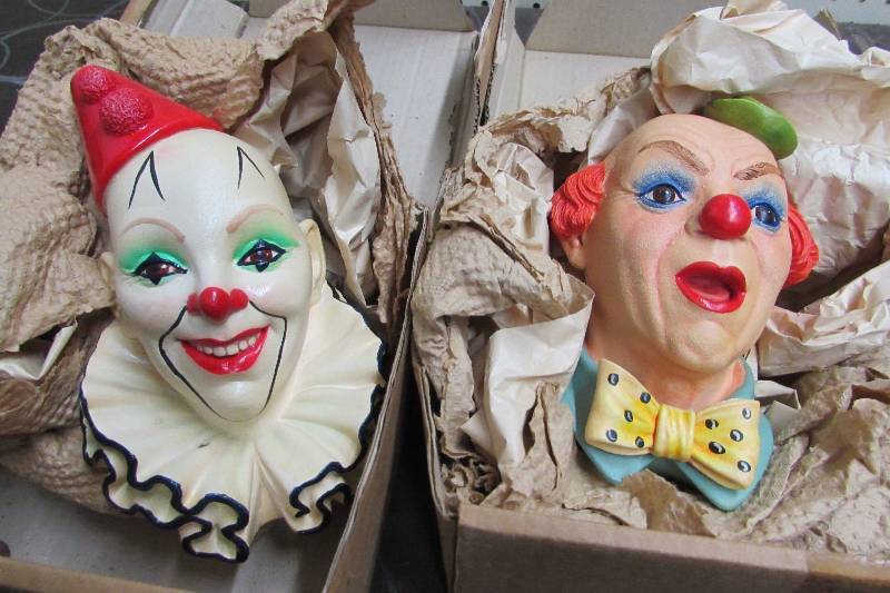 lot 542 image: TWO CLOWN HEAD WALL PLAQUES