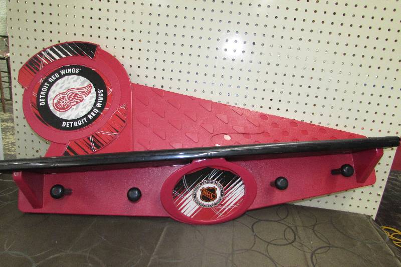 lot 564 image: NHL DETROIT RED WINGS PLASTIC SHELF WITH HOOKS