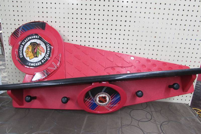 lot 565 image: NHL CHICAGO BLACKHAWKS PLASTIC SHELF WITH HOOKS