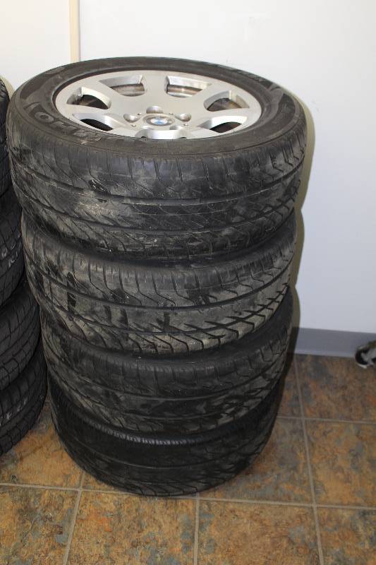 lot 13 image: Lot of (4) BMW 16in. Wheels w Kumho All Season P22555R16 Tires