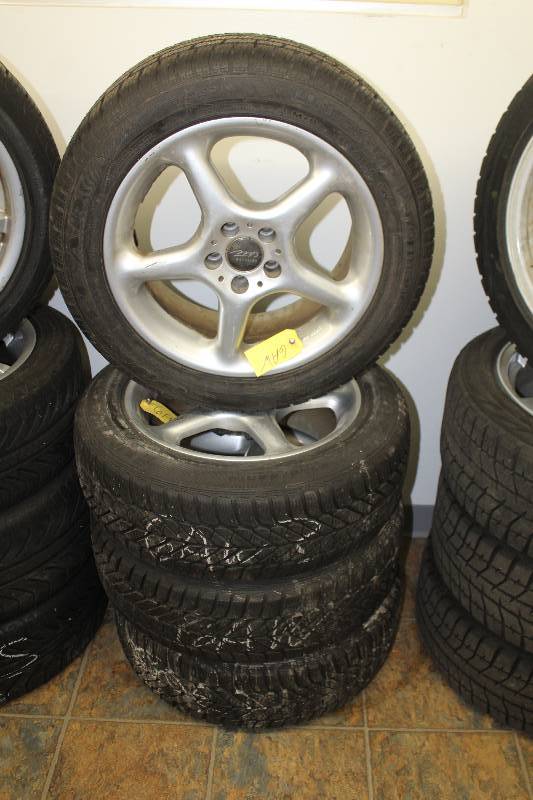 lot 15 image: Lot of (4) MB Motoring 16in. Wheels w Goodyear Ultragrip P20555R16 Tires
