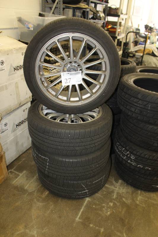 lot 27 image: Lot of (4) Enkei Universal 18in. Wheels w Goodyear P23545R18 Tires