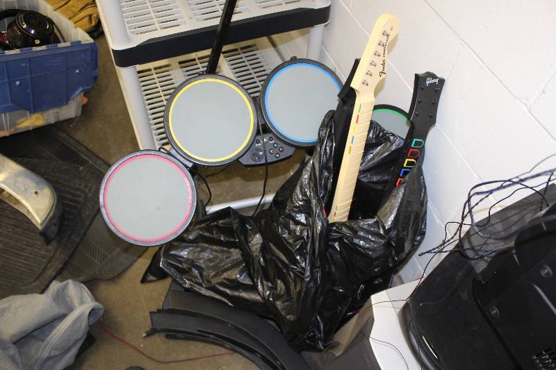 lot 68 image: Sony Playstation Rock Band Controllers Includes Drum Kit, Several Guitars