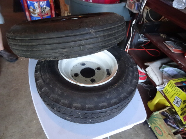 lot 175 image: 4 Hole Rim and Tire 4-804.00-12