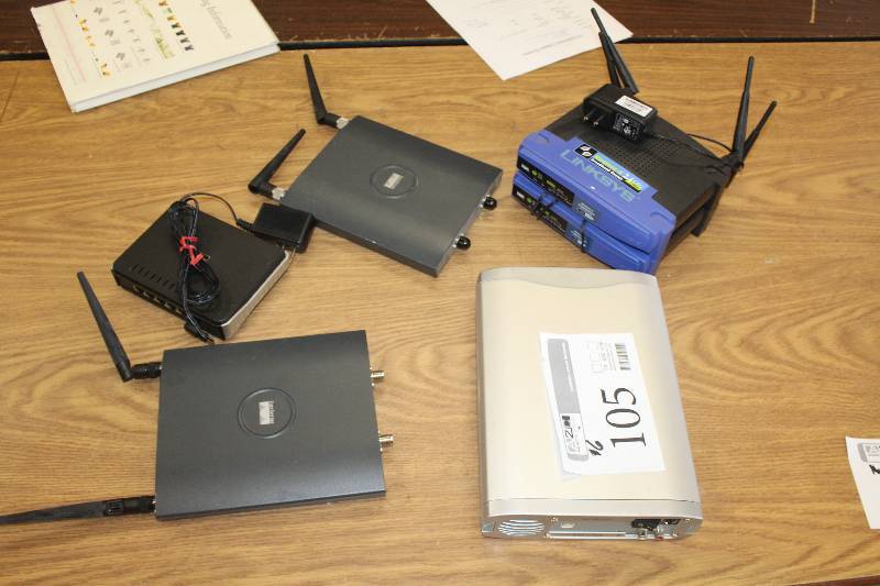 lot 105 image: Lot of (6) Electronics Includes 2) Linksys 2.4 GHz Wireless-G Broadband Routers AND 2) Cisco Systems Aironet 802.11 abg Access Port AND 1) D-Link DES-1105 Hub AND 1) External DVD Drive
