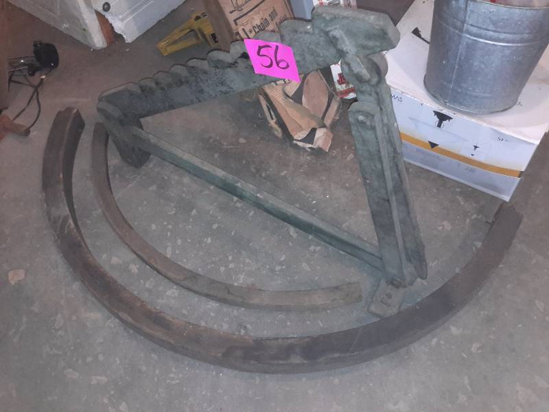 lot 56 image: Antique Wood Buggy Jack and parts of wagon wheels