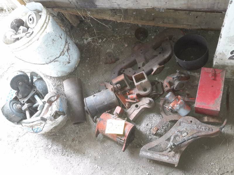 lot 215 image: Misc. Tractor Parts.. Pail of Wheels and casters