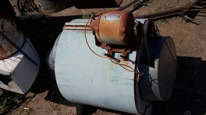 lot 260 image: Old wood stove furnace plus old squirrel cage fan..