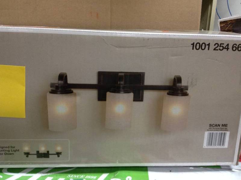 lot 84 image: Hampton Bay 3-Light Oil-Rubbed Bronze Vanity Light Model#  WB1001-VF  open box never used