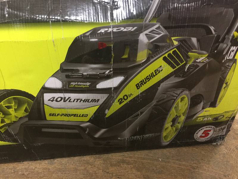 lot 124 image: Ryobi 20 in. 40-Volt Brushless Lithium-Ion Cordless Battery Push Lawn Mower - 5.0 Ah Battery and Charger Included in like new conditions