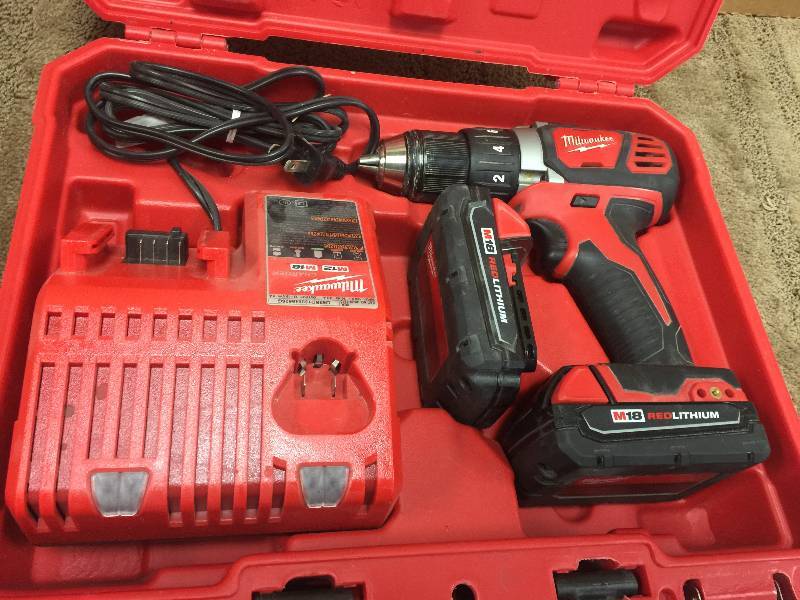 lot 129 image: Milwaukee M18 Compact 12 Inch Drill Driver Kit - Two M18 Compact RedLithium 1.5Ah Batteries, Model 2606-22 in working conditions