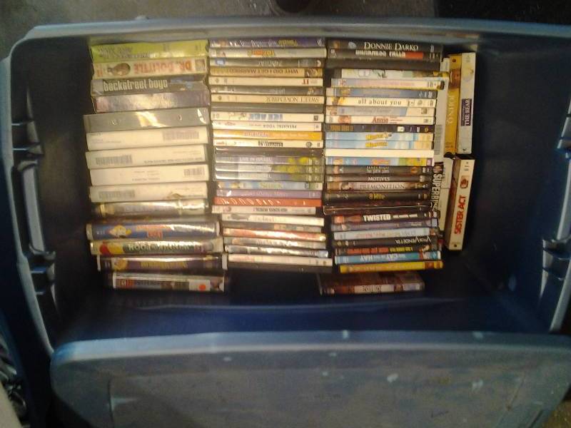 lot 23 image: Large Tote With Lid Full Of VHS Movies & 54 DVDs