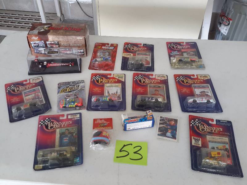 lot 53 image: Large lot of small scale NASCAR toy Dragsters as pictured