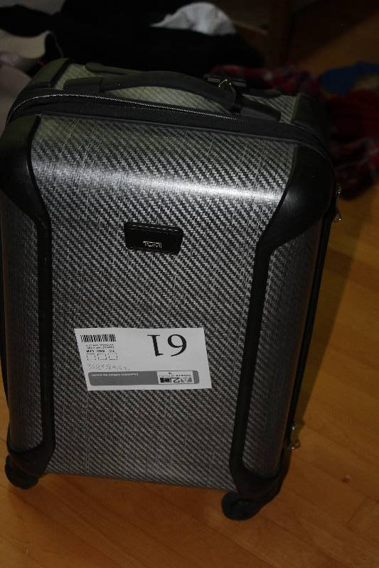 lot 61 image: Tumi Rolling Suitcase