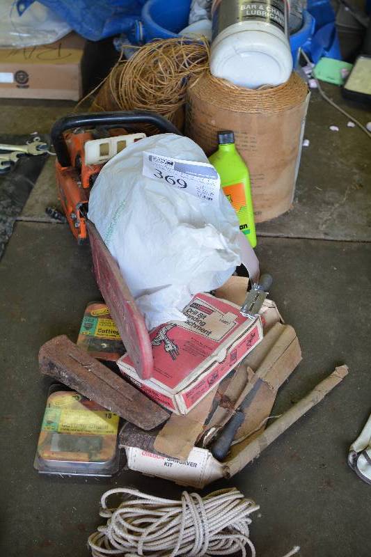lot 369 image: Chainsaw Equipment Includes Olympic 251 Super 18in. Saw w Chain Cover, Cutting Blades, Bar Oil, Twine, Hard Hats, And More