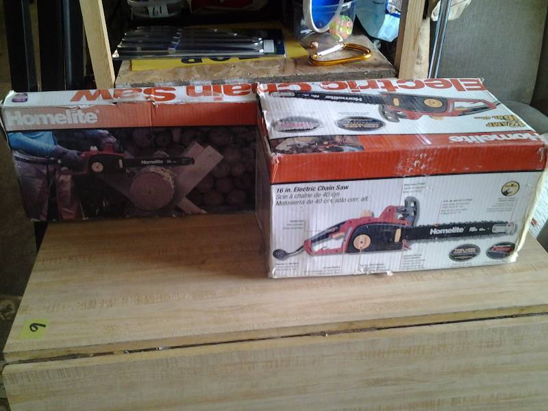 lot 20 image: New Homelite 12 Amp 16 Inch Electric Chain Saw