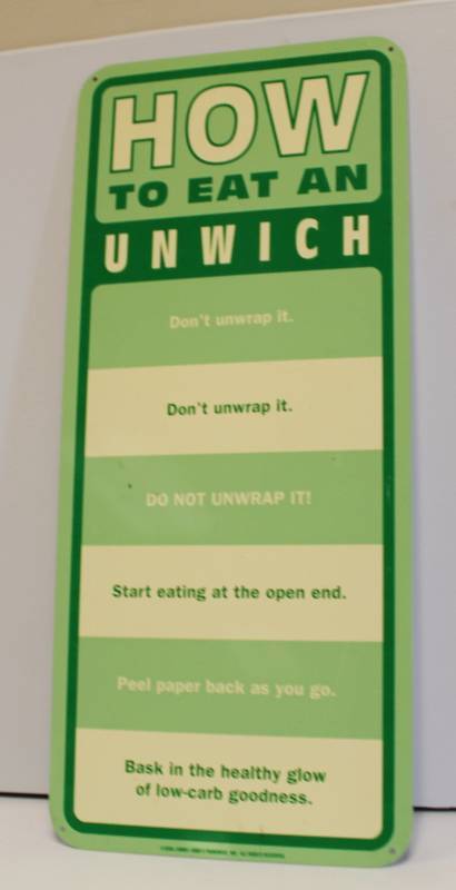 lot 56 image: How To Eat An Unwich JJ Sign