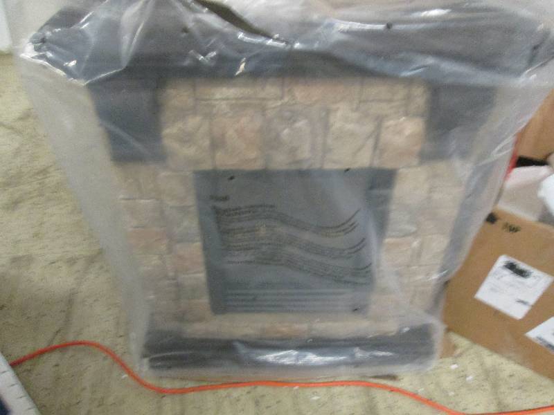 lot 14 image: Stone Electric Fireplace out of box...
