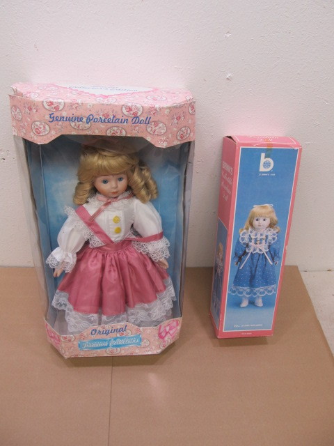 lot 132 image: 2 Mint in Box Porcelain Dolls