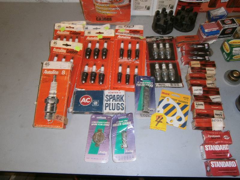 lot 178 image: Box of New Old Stock Automotive Items - Spark Plugs, Oil Filters and more