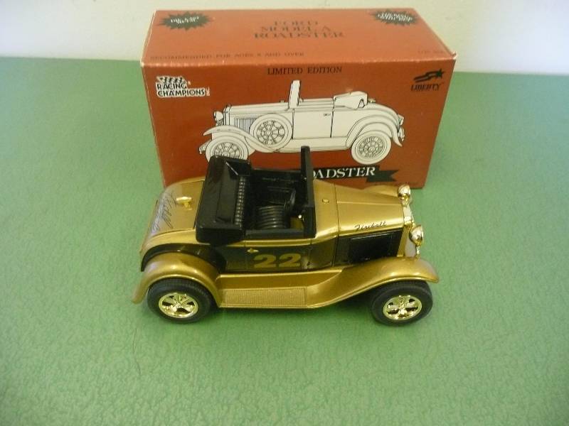 lot 17 image: Fireball Roberts 124 Diecast Model A Roadster Racing Champions Locking Bank - New In Box - See Pictures