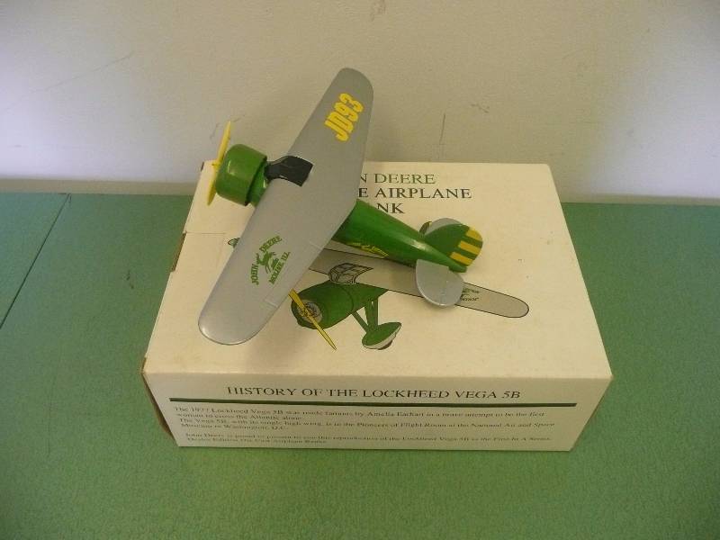 lot 26 image: JOHN DEER VINTAGE AIRPLANE BANK - 1927 LOCKHEED VEGA 5B MADE FAMOUS BY AMELIA EARHART - SPEC CAST 1992 - SEE PICTURES