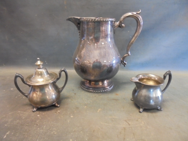lot 25 image: Silver Plate Pitcher and Cream and Sugar service