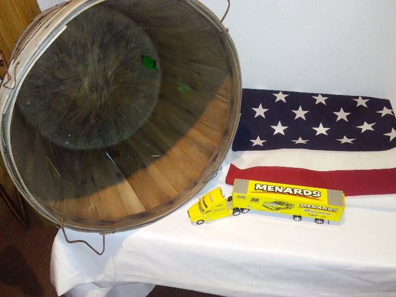 lot 60 image: Americana (8 in x 34 in) flag, Menards tractortrailer, bushel basket.