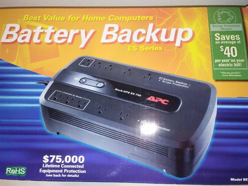 lot 62 image: Battery Back Up works for computers and electronics. Surge and light protector made by APC.