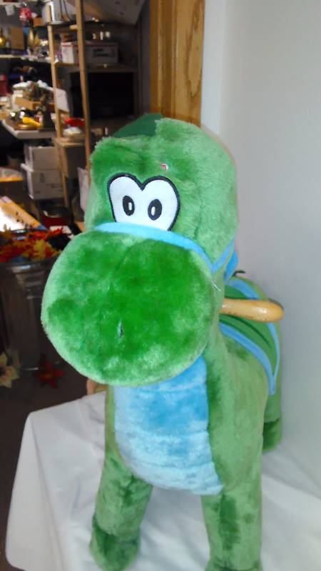 lot 33 image: Chrisha Riding Dinosaur makes prehistoric sounds