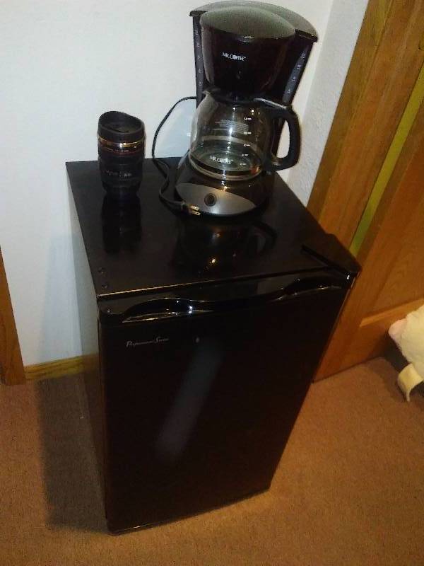 lot 120 image: Dorm Mini Fridge and Mr. Coffee maker, Cannon Travel Mug looks like Camera Lens, Fridge is 3 cubic ft.