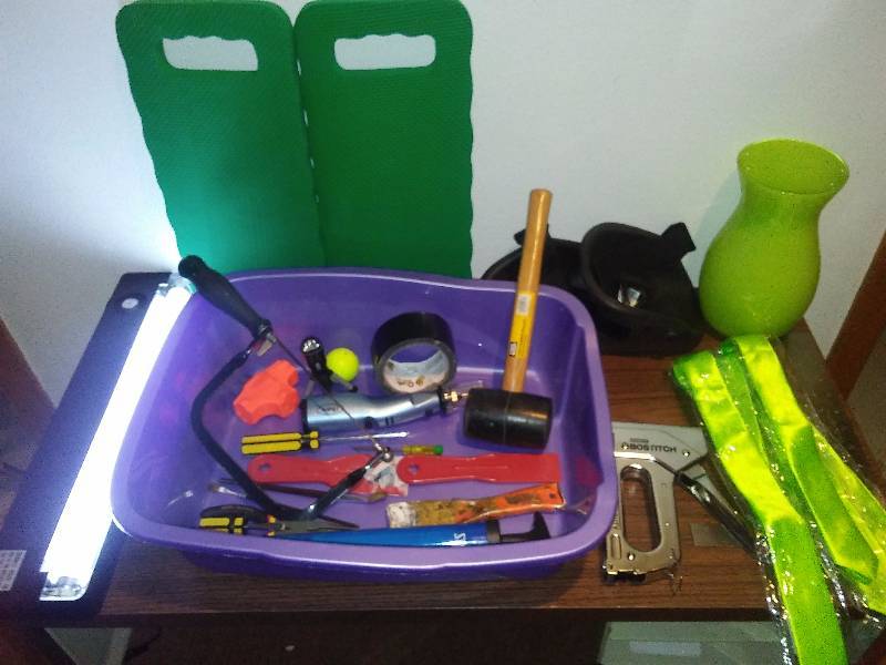 lot 123 image: Misc. Tools and more Knee pads, 18 light, saw, plastic tote, Oster Rotary Tool and more  See Pictures