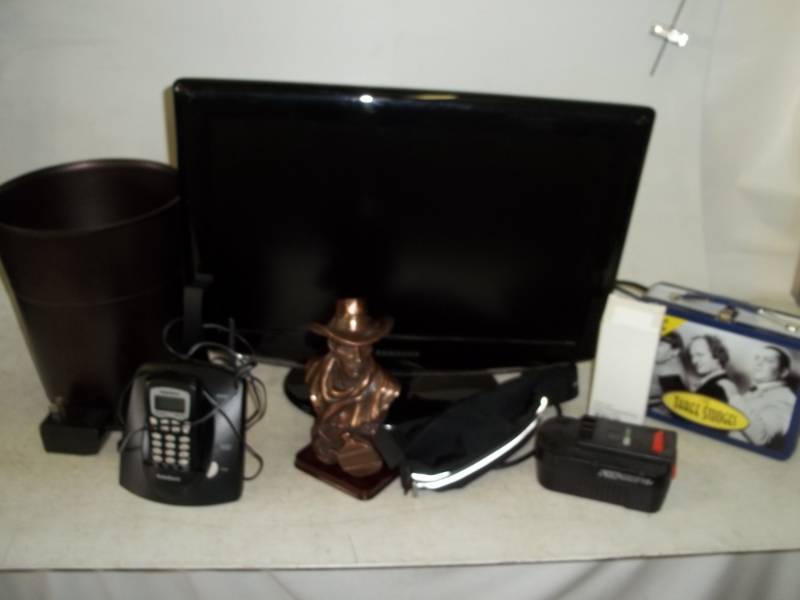lot 124 image: Garbage can, bust, Telephone, battery, DVDs and Samsun TV needs repair