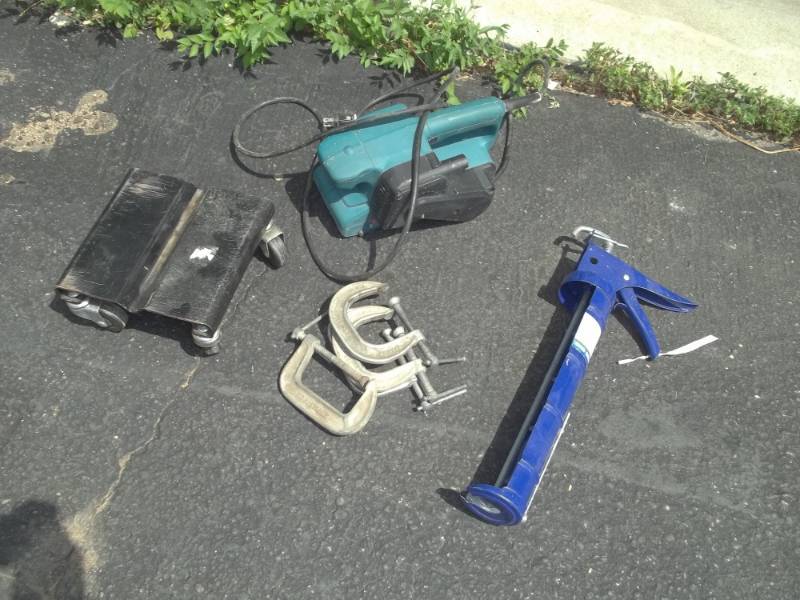 lot 157 image: Makita Belt Sander, Clamps, Dollies and Large Caulking Gun