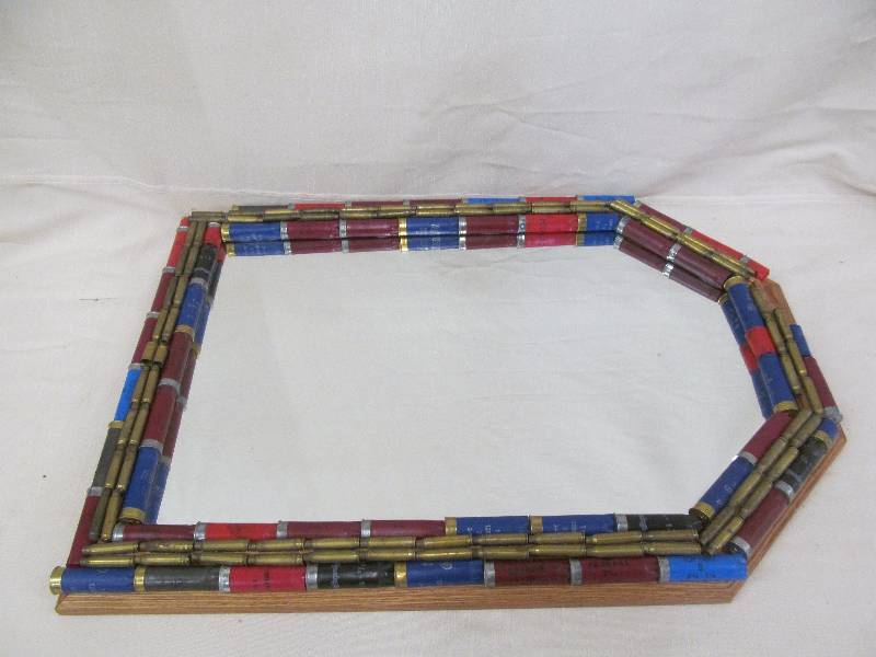 lot 52 image: shotgun shell framed mirror