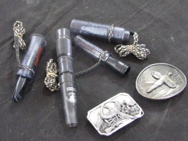lot 72 image: Game Calls & Buckles