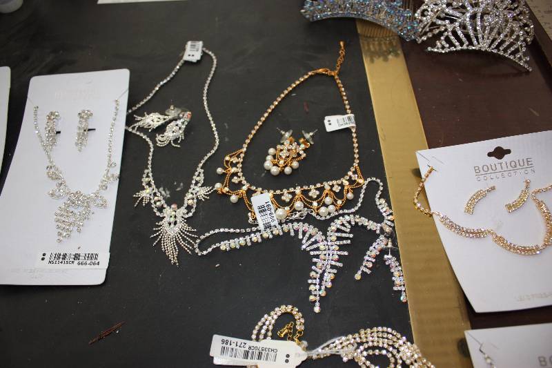 lot 136 image: 12 NEW Rhinestone necklace and earring sets.