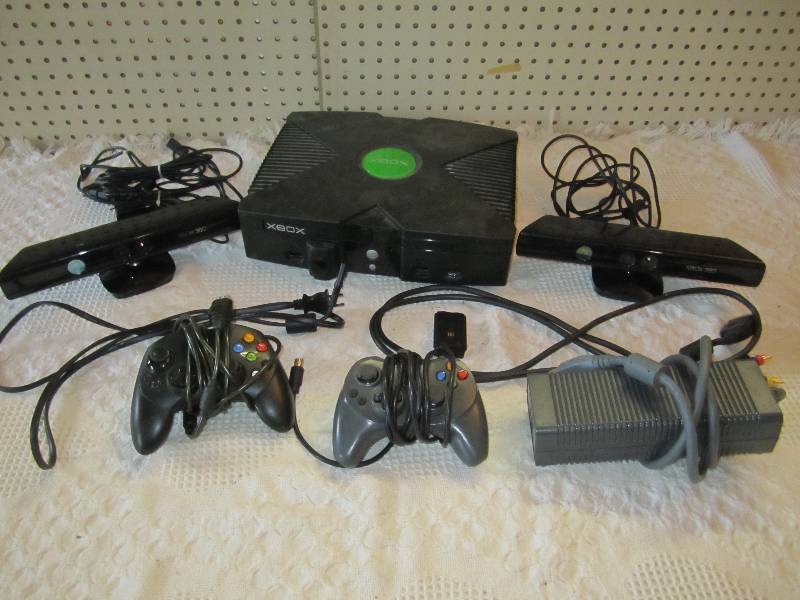 lot 26 image: XBOX with accessories. See photos....