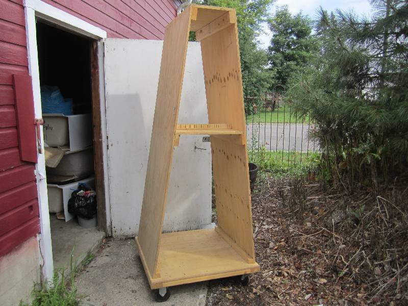 lot 117 image: Large wood display unit on 5 caste...