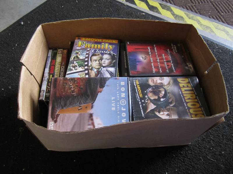 lot 131 image: Lot of DVD and VHS Movies. ...