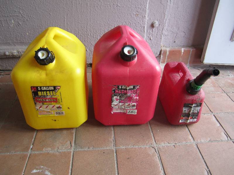 lot 193 image: 5 and 1.25 Gallon Gas Cans and two ...