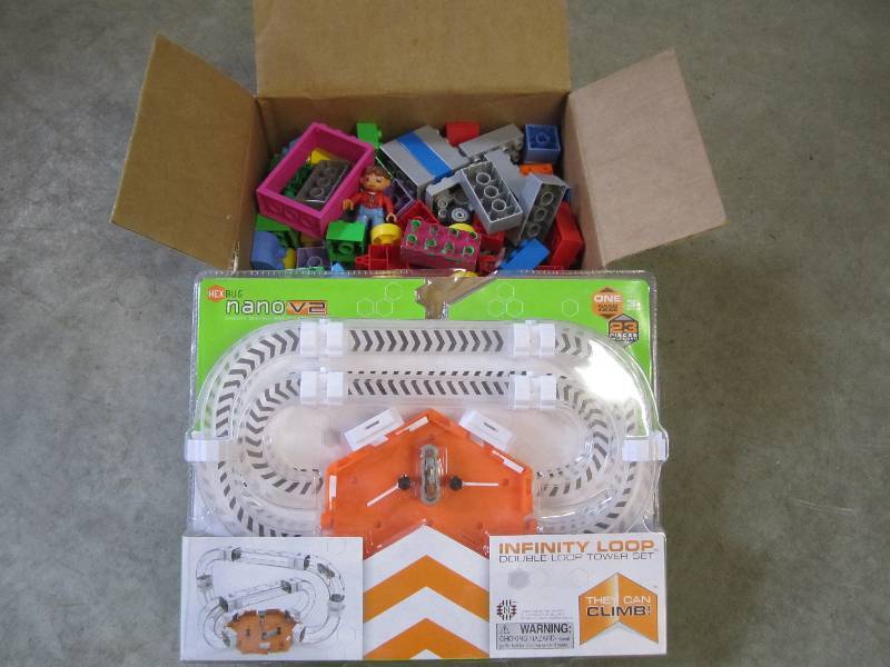 lot 216 image: Box of Legos and a Hex Bug Nano V2 ...