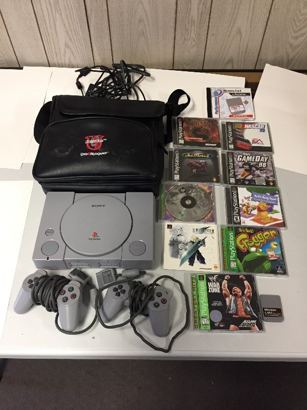 lot 54 image: Sony Playstation Game, 2 Controllers, Memory Card, 7 Games, Carrying Case
