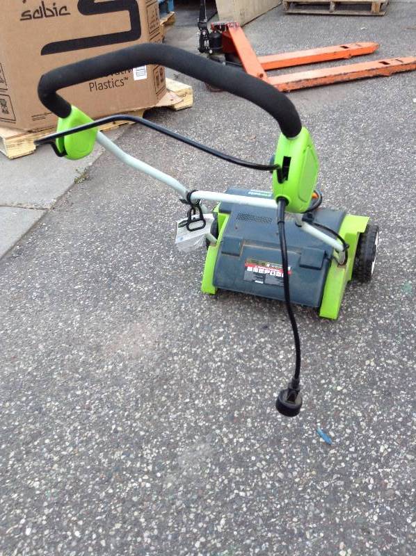 lot 120 image: Greenworks 10A Electric Dethatcher used in working condition