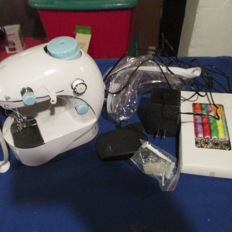 Small Sewing Machine, Iron, Ironing Board & Misc.