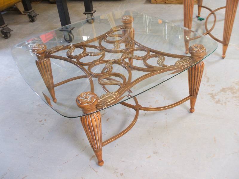 lot 605 image: WOOD, METAL AND GLASS COCKTAIL TABLE
