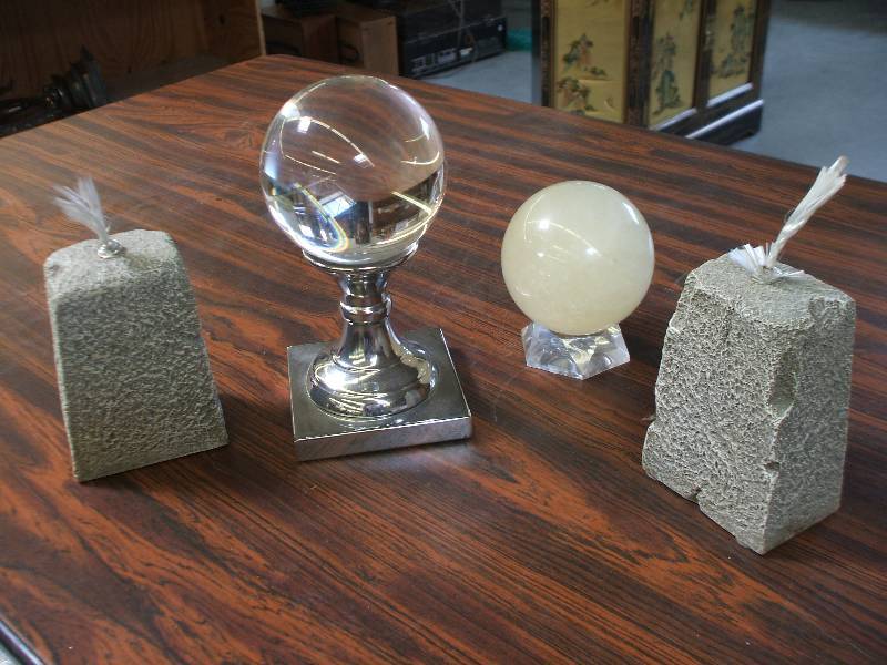 lot 657 image: CRYSTAL BALL, STONE ORB AND OIL LAMPS